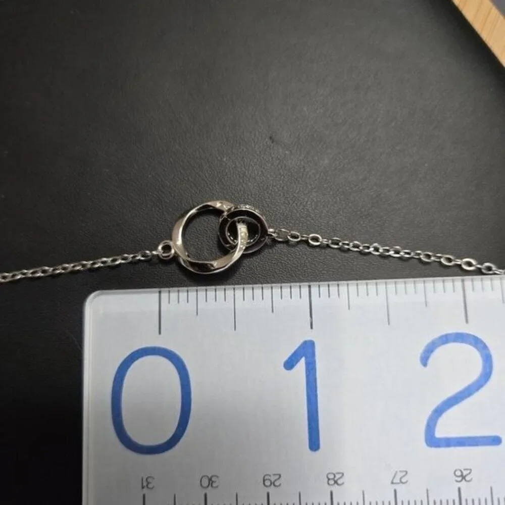 Interlocking Mobius Engraved Necklace in‎ Silver (NWOT)